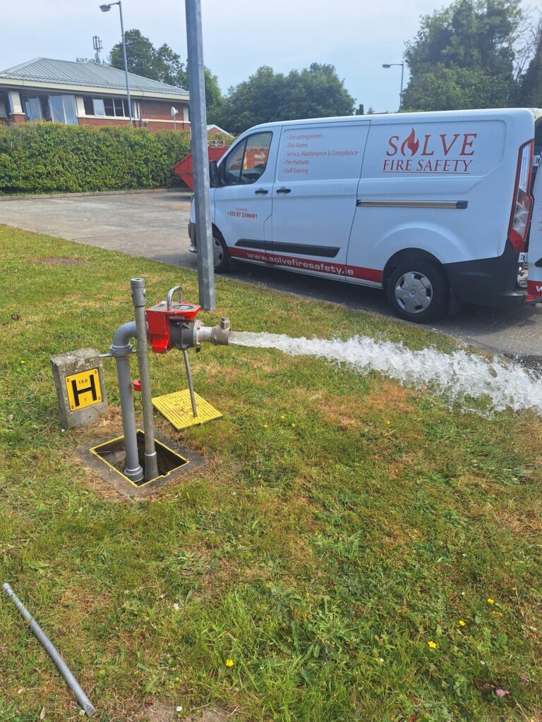 Engineer performing I.S. 391:2020 fire hydrant flow and pressure test in Ireland