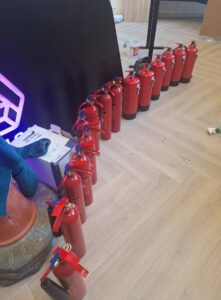 New fire extinguishers lined up for installation by Solve Fire Safety technicians in a modern commercial premises in Monaghan.
