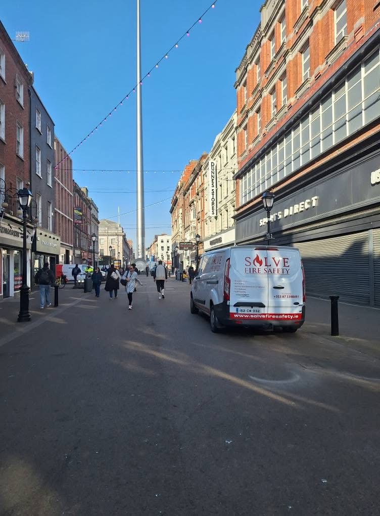 Solve Fire Safety van parked on Dublin's O'Connell Street near the Spire, providing commercial fire safety services and compliance in Dublin City Centre.